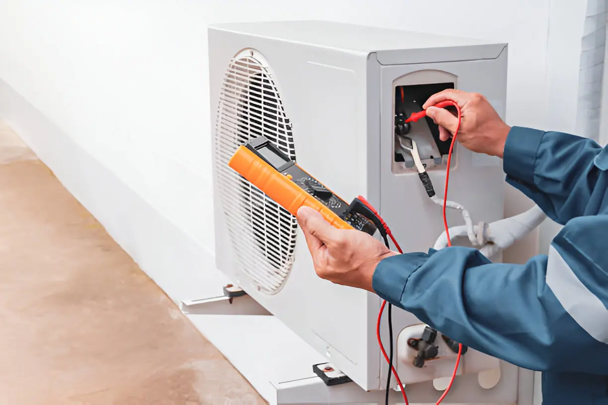 Professional HVAC Service technician replacing air filter to improve air quality and efficiency.