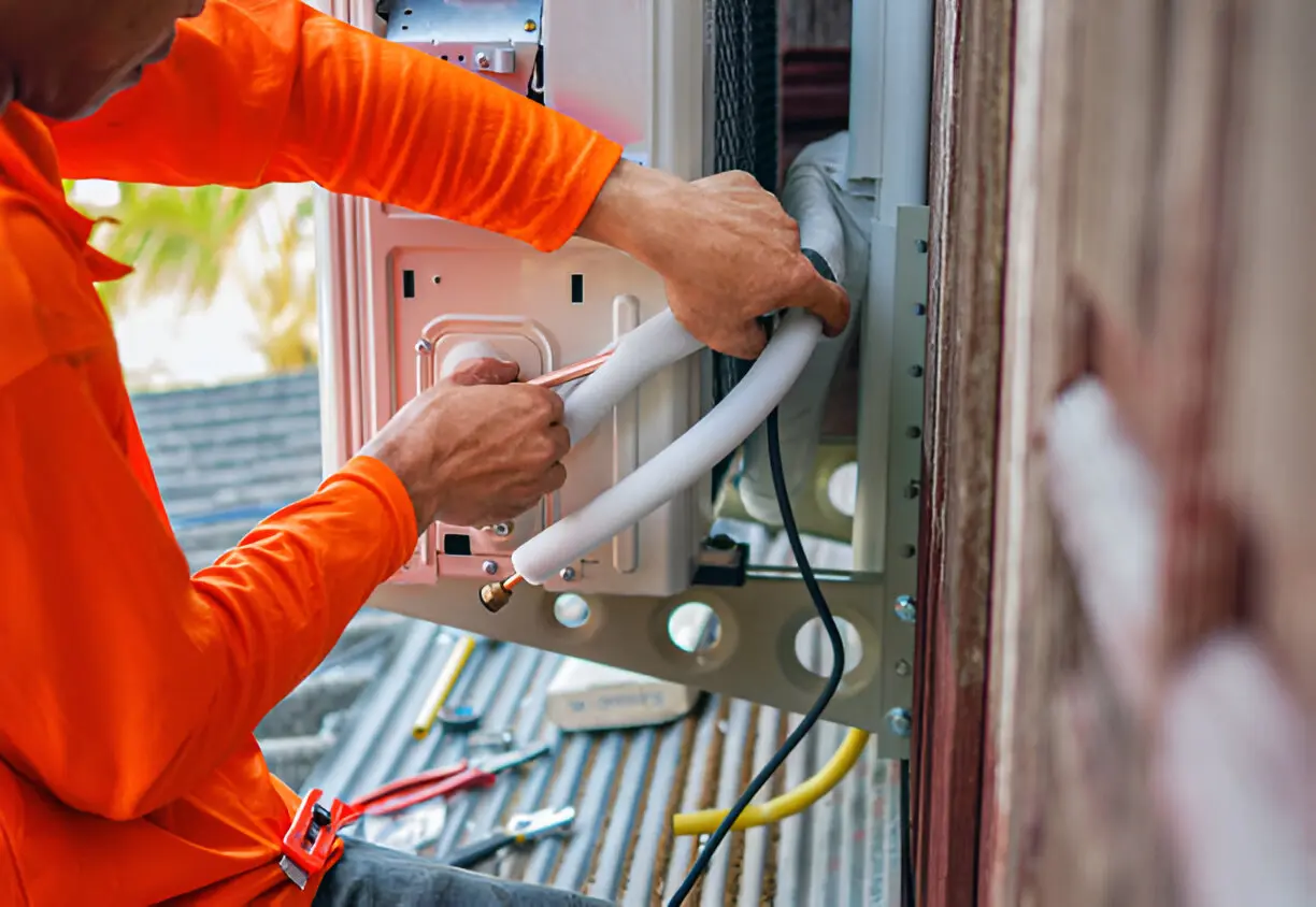 Air Conditioning Contractor Goulds conducting preventative maintenance on central air system.